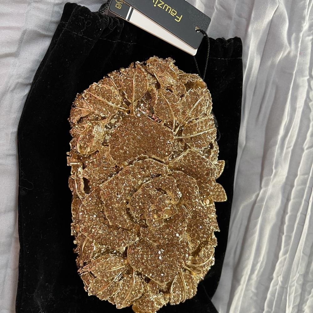 New With Tags -  Gorgeous and elegant gold clutch handbag.